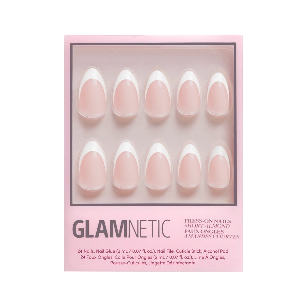 A box of glamnetic Ma Damn cruelty-free press-on nails in a short almond shape and light pink color. Includes 24 nail tips, glue, file, cuticle stick, and alcohol pad, all packaged in stylish pink.
